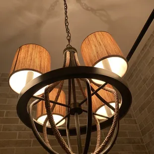 a chandelier with four lamps