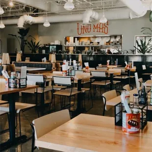 a restaurant with tables and chairs