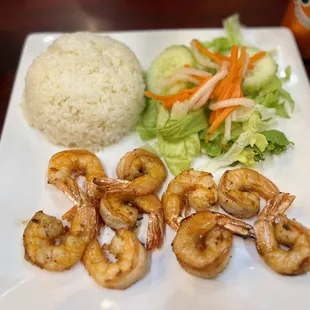 a plate of shrimp and rice