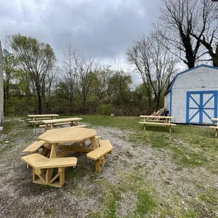 a picnic table and barn