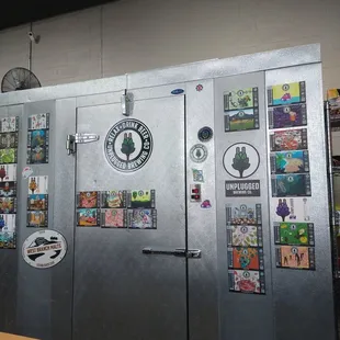 a refrigerator covered in stickers