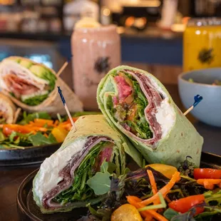 a plate of sandwiches and a salad