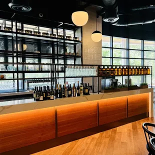 a bar with lots of bottles of wine