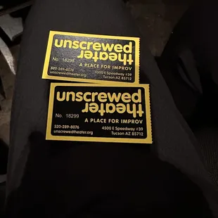 a pair of unscrewed tickets