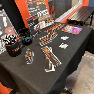 a black table with a black table cloth and a black table cloth with a black table cloth and a black