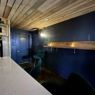 a kitchen with a blue wall
