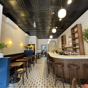 a restaurant with black and white tiles