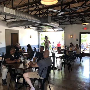 a group of people sitting at tables
