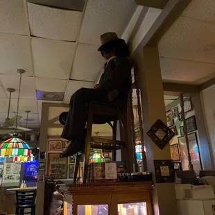 Some mobster watching over the joint.