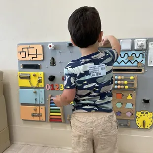 He loves this sensory board!