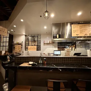 a counter with a laptop on it