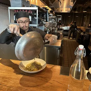 Chef serving our pasta dish