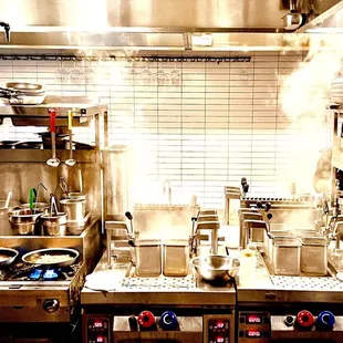 a kitchen with a lot of pots and pans