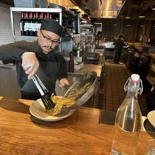 Chef serving Tagliatelle ai Carciofi