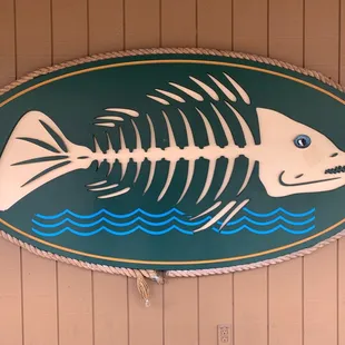 a fish skeleton on a sign