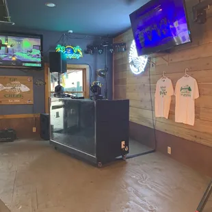 a bar with a large screen tv