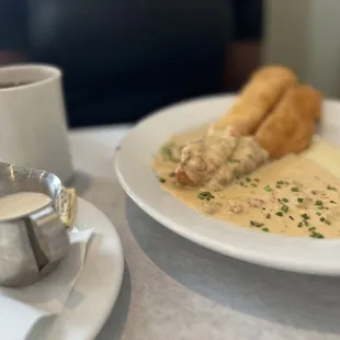 a plate of food and a cup of coffee