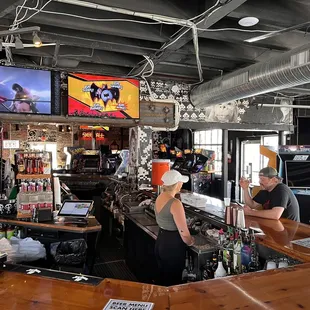 a man and a woman at a bar