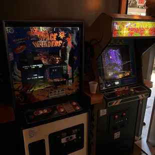 two arcade machines in a room