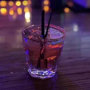 a shot of a purple cocktail