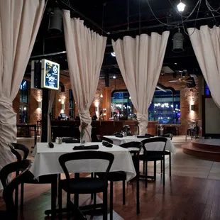 a restaurant with tables and chairs