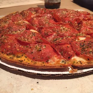 a pizza with tomatoes on it