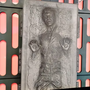 a statue of a man holding a knife