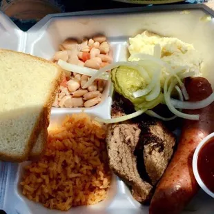 #6- Brisket plate with a choice of rib or sausage w/ trimmings
