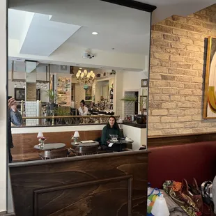 a woman sitting at a restaurant counter