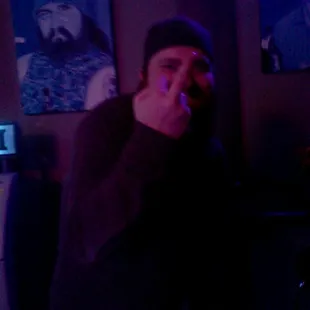 a man sitting in a dark room