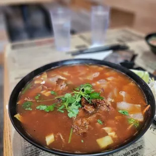 Spicy brisket &amp; grilled pork pho with added tendon. Huge portions with great taste.