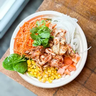 Mexican Chicken. Comes w/ Lettuce, Carrots, Sweet Onion, Corn, Cilantro and Fried Onion.