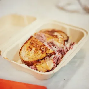 a sandwich in a styrofoam container