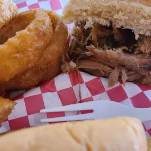 Golden Onion rings, yes! Half pulled pork sandwich &amp; half catfish sandwich shared with partner!