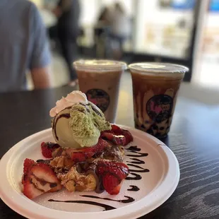 Belgian waffle with strawberries Nutella and green tea ice cream