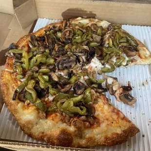 Vegan cheese pizza with bell pepper mushrooms and vegan sausage