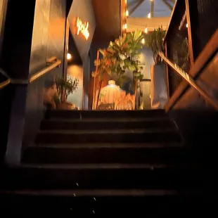 a staircase leading to a dining room