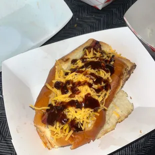 a hot dog with chili and cheese