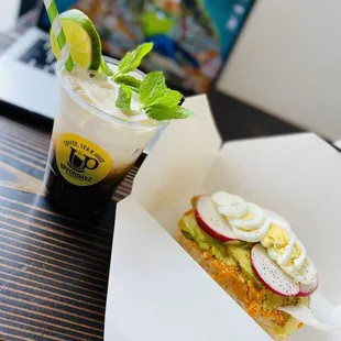 a cup of coffee and a sandwich