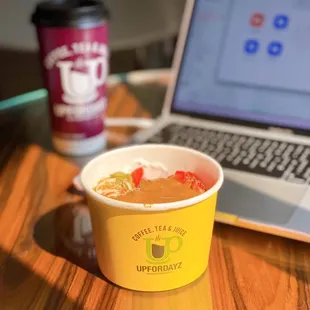 a cup of coffee and a laptop