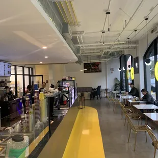 a restaurant with a yellow counter