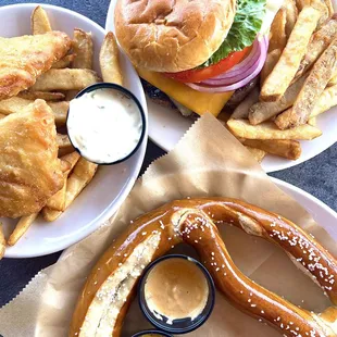 a pretzel, a pretzel sandwich, and fries