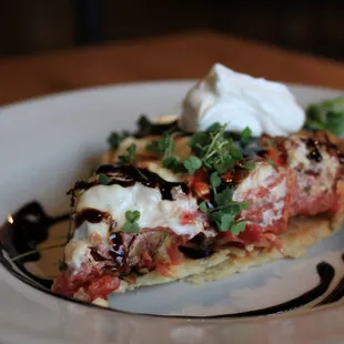 INDIANA TOMATO PIE
summer tomatoes, parmesan cheese, sour cream, chives, &amp; balsamic syrup
