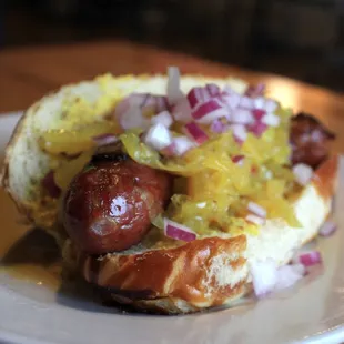 a hot dog with sauerkraut and onions