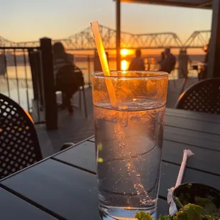 A beautiful sunset and a lovely beverage! Come visit eat, have a great beer. Great place,food and people