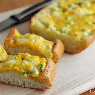 Cheesy bread with mozzarella and cheddar blended with our garlic aioli sauce
