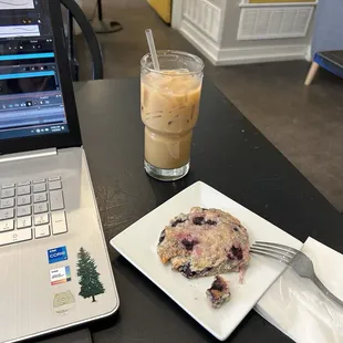 Homework with Iced latte and blueberry lemon scone!