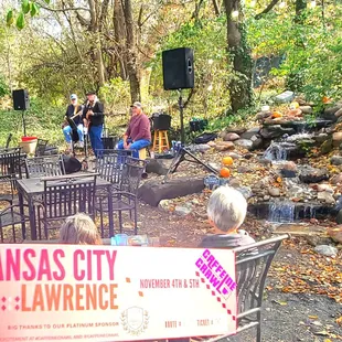 a group of people sitting in a park