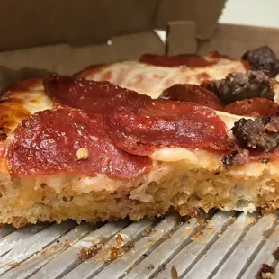 American Pan crust with tomato sauce, pepperoni and sausage