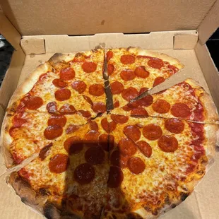 a pepperoni pizza in a box